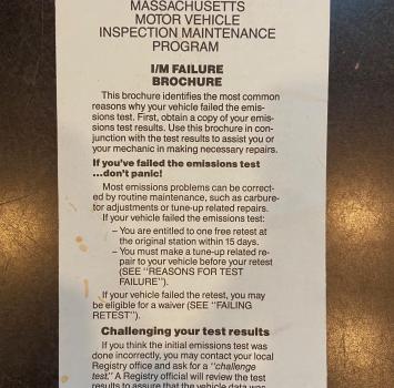 Assuming the car was parked because it failed the MA emissions inspection...?